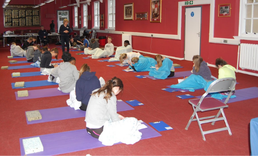 Caroline and Daniel teaching in school