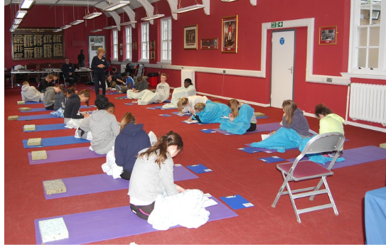 Caroline and Daniel teaching in school